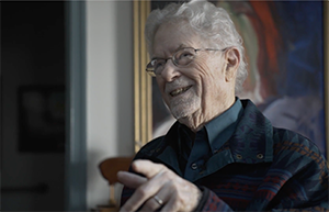 smiling man with friends at senior living community